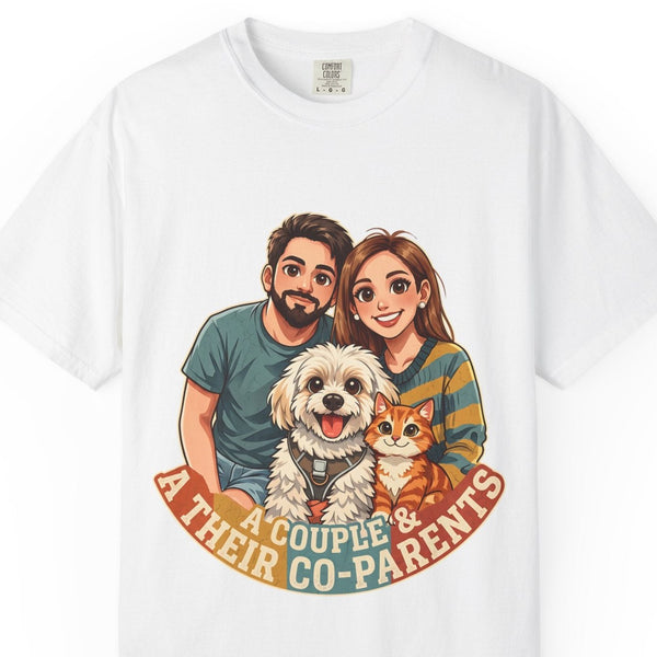 Close-up of the A Couple & Their Co-Parents print: couple with a fluffy white dog and an orange cat over a rust ribbon, on the White tee